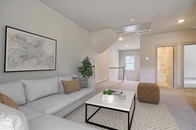 living area with carpet floors, visible vents, and recessed lighting