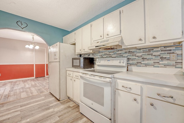 4606 Moss Ct, North Charleston, SC 29420 - kitchen featuring white appliances, under cabinet range hood, arched walkways, backsplash, and a textured ceiling