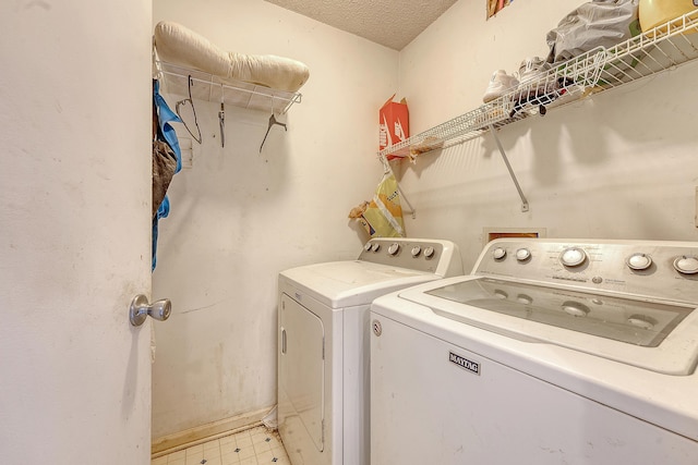 4606 Moss Ct, North Charleston, SC 29420 - laundry area featuring washing machine and dryer, light flooring, and baseboards