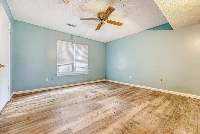 4606 Moss Ct, North Charleston, SC 29420 - empty room featuring a textured ceiling, wood finished floors, a ceiling fan, and baseboards