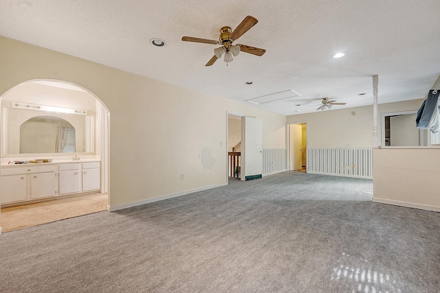 4606 Moss Ct, North Charleston, SC 29420 - unfurnished living room featuring ceiling fan, carpet flooring, a sink, recessed lighting, and a textured ceiling