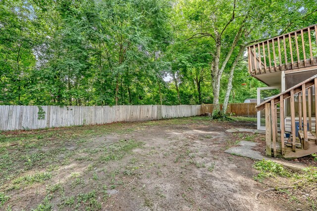 4606 Moss Ct, North Charleston, SC 29420 - fenced backyard featuring a wooden deck
