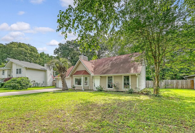4606 Moss Ct, North Charleston, SC 29420 - view of front facade with driveway, a chimney, and an attached garage