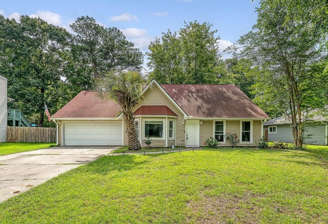 4606 Moss Ct, North Charleston, SC 29420 - view of front facade with a garage, concrete driveway, and a chimney