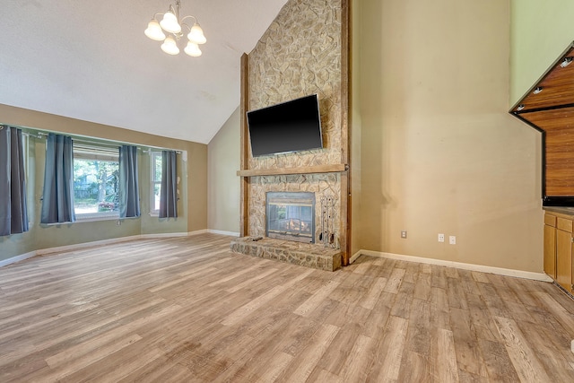 4606 Moss Ct, North Charleston, SC 29420 - unfurnished living room with a chandelier, a fireplace, light wood-style floors, baseboards, and high vaulted ceiling