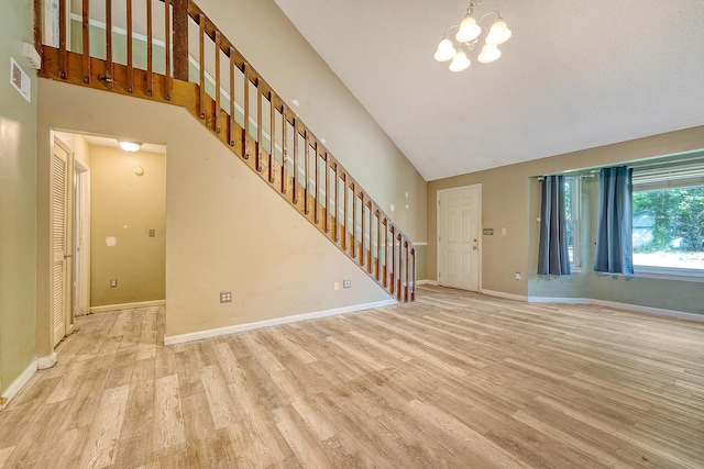 4606 Moss Ct, North Charleston, SC 29420 - unfurnished living room with light wood-style floors, stairway, high vaulted ceiling, a chandelier, and baseboards