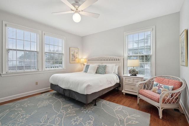 bedroom featuring ceiling fan and dark hardwood / wood-style floors