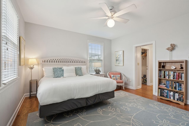 bedroom with hardwood / wood-style floors and ceiling fan