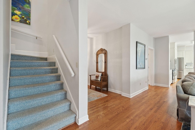 stairway with wood-type flooring