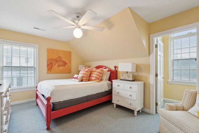 carpeted bedroom featuring vaulted ceiling and ceiling fan