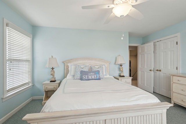 bedroom featuring ceiling fan, a closet, carpet floors, and multiple windows