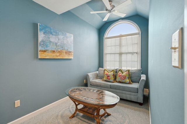 carpeted living room with lofted ceiling and ceiling fan