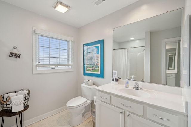 bathroom featuring vanity, toilet, and curtained shower