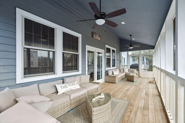 sunroom / solarium featuring vaulted ceiling and ceiling fan