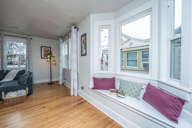 sitting room featuring light hardwood / wood-style flooring