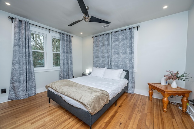 bedroom featuring ceiling fan and light hardwood / wood-style floors