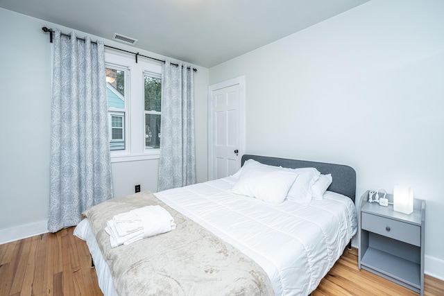 bedroom with wood-type flooring