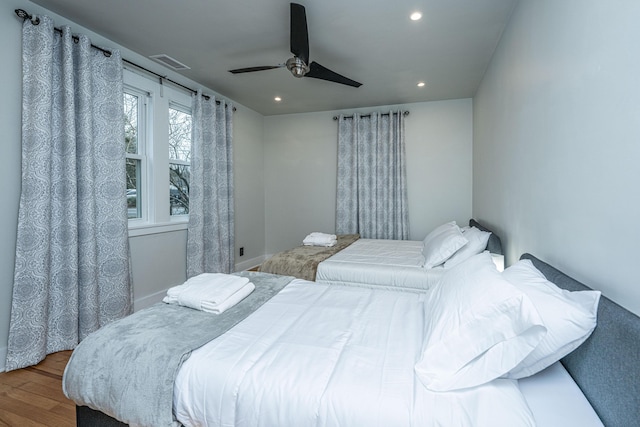 bedroom with hardwood / wood-style flooring and ceiling fan