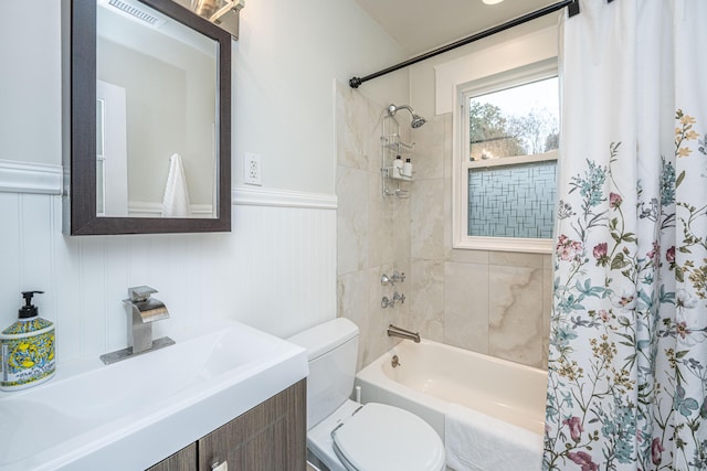 full bathroom featuring shower / tub combo, vanity, and toilet