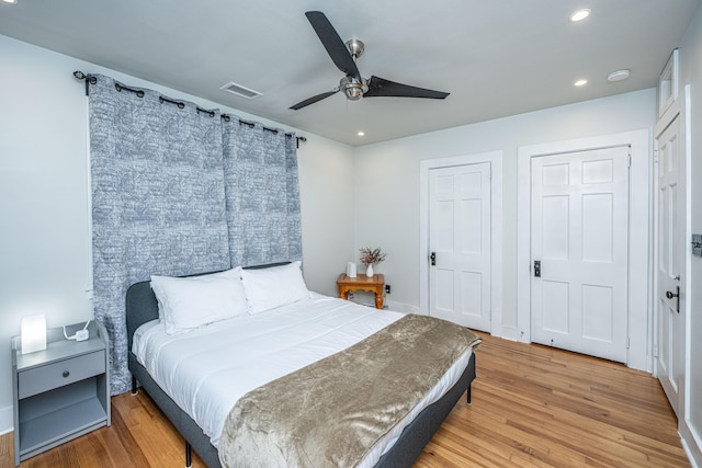 bedroom with ceiling fan and hardwood / wood-style floors