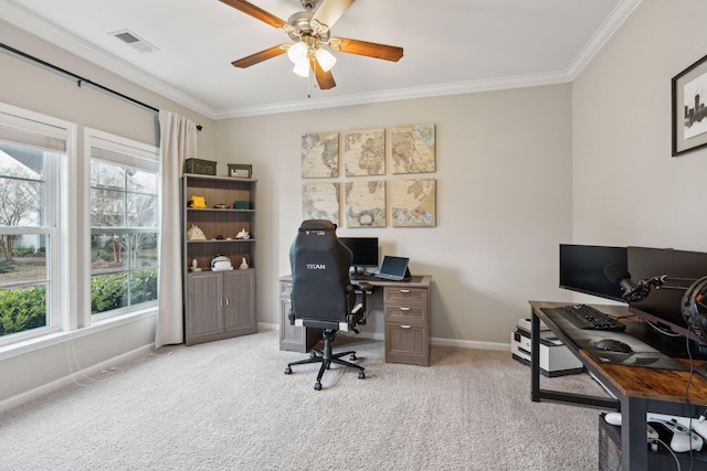 carpeted office space with crown molding and ceiling fan