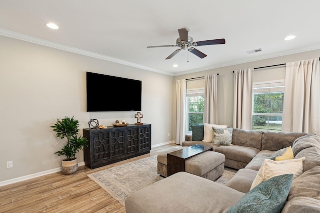 living room featuring ornamental molding, ceiling fan, and light hardwood / wood-style floors