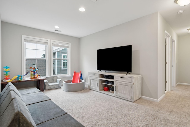 living room featuring light carpet