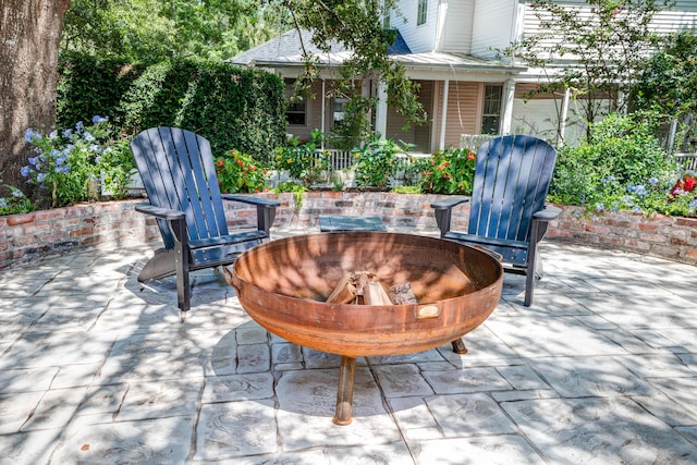 view of patio / terrace featuring a fire pit