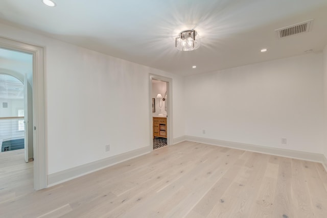 spare room featuring recessed lighting, visible vents, baseboards, and light wood finished floors