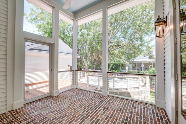 unfurnished sunroom with plenty of natural light