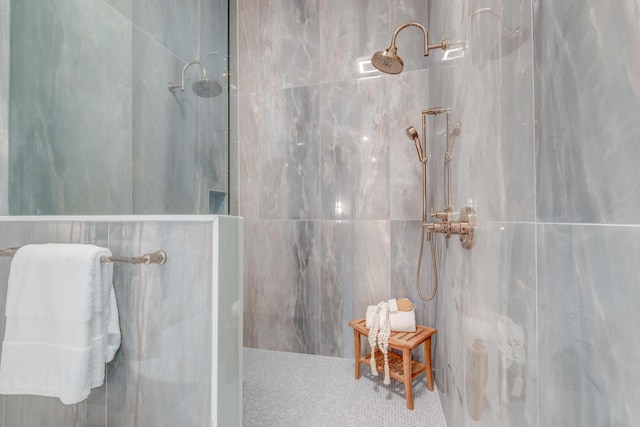 full bath with a marble finish shower