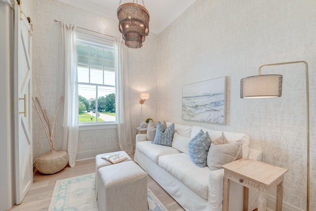 living area featuring baseboards, light wood-style flooring, and wallpapered walls