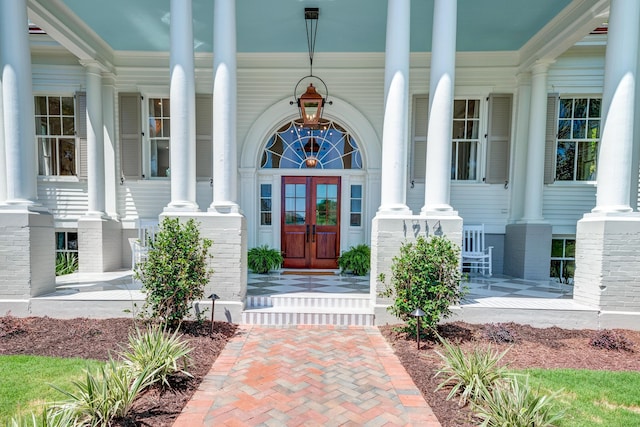 doorway to property with french doors and a porch