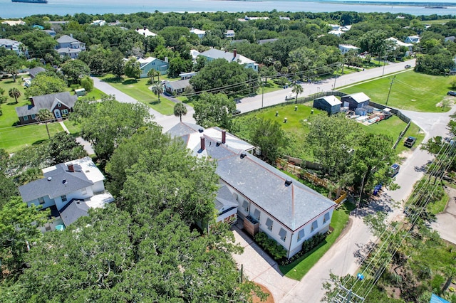 birds eye view of property with a residential view and a water view