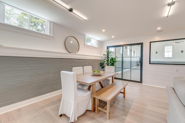 dining room featuring recessed lighting, a healthy amount of sunlight, and light wood-type flooring