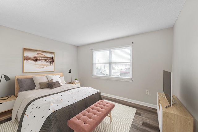 bedroom featuring dark hardwood / wood-style flooring