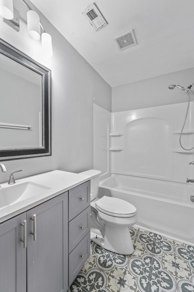 full bathroom with bathtub / shower combination, vanity, and toilet