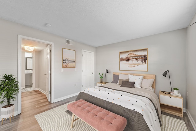 bedroom featuring wood-type flooring