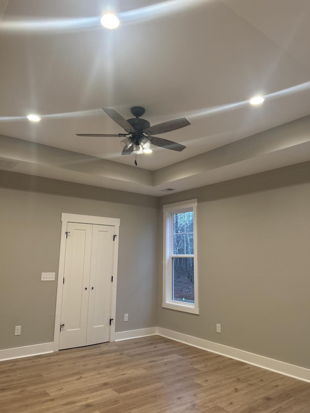 spare room featuring hardwood / wood-style flooring and ceiling fan