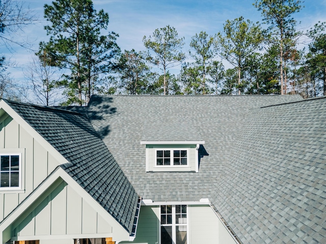 details with a shingled roof and board and batten siding