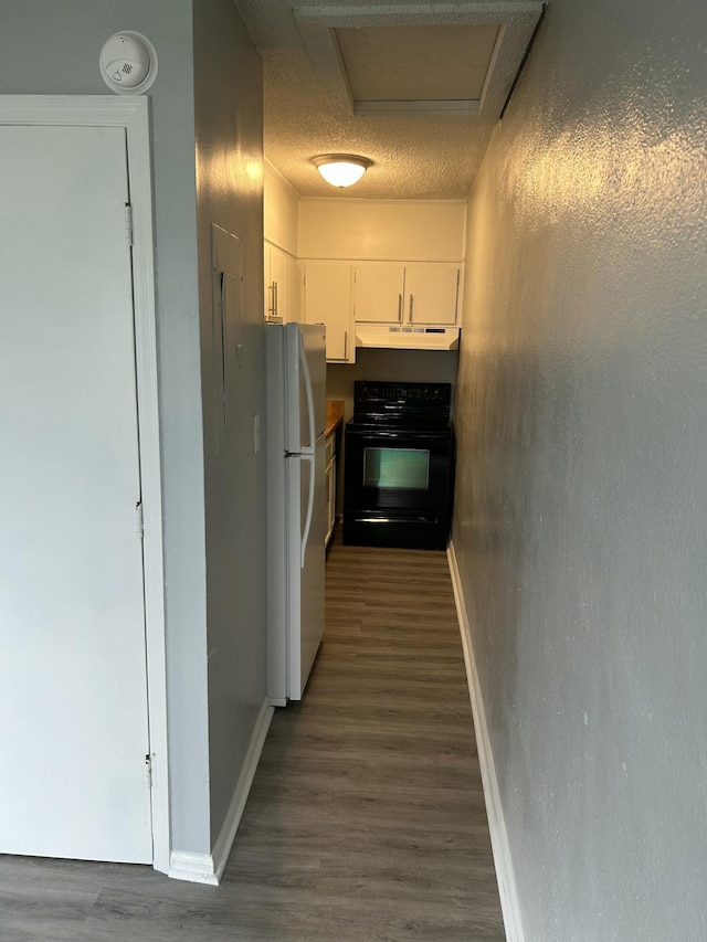 hallway with baseboards and dark wood-type flooring