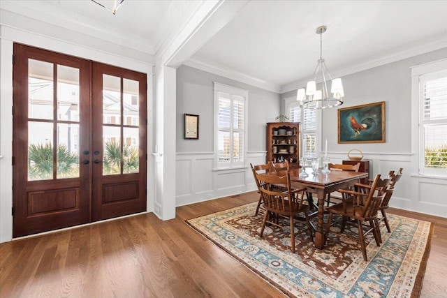 1962 Bellona St, Charleston, SC 29492 - dining space featuring crown molding, french doors, wood finished floors, and a notable chandelier