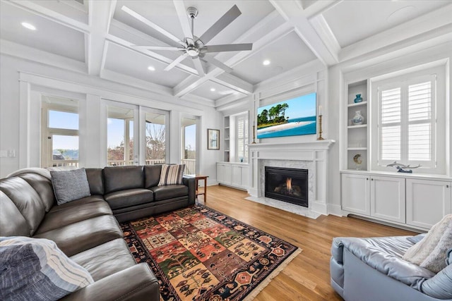 1962 Bellona St, Charleston, SC 29492 - living room with built in features, coffered ceiling, light wood-style floors, a fireplace, and beam ceiling
