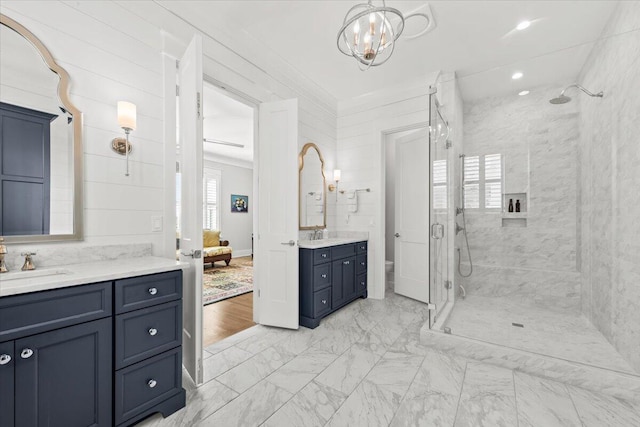 1962 Bellona St, Charleston, SC 29492 - bathroom with a stall shower, two vanities, a sink, and a wealth of natural light