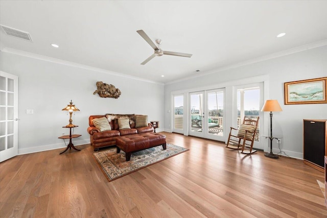 1962 Bellona St, Charleston, SC 29492 - living room featuring light wood-type flooring, visible vents, ornamental molding, and french doors