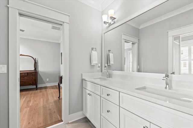 1962 Bellona St, Charleston, SC 29492 - bathroom with double vanity, visible vents, ornamental molding, and a sink