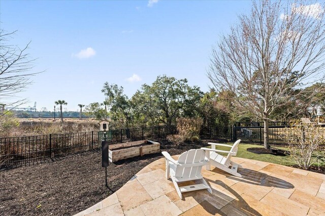 1962 Bellona St, Charleston, SC 29492 - view of patio / terrace with a fenced backyard and a vegetable garden