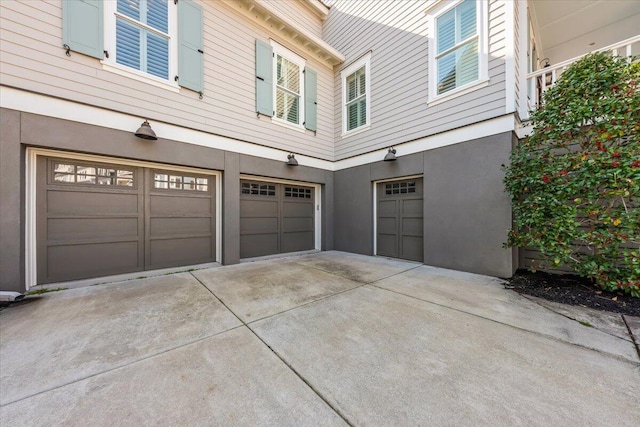 1962 Bellona St, Charleston, SC 29492 - view of home's exterior featuring driveway, an attached garage, and stucco siding