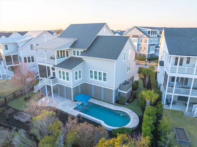 1962 Bellona St, Charleston, SC 29492 - exterior space featuring a residential view, metal roof, a patio, and a balcony