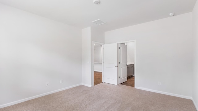 unfurnished bedroom with carpet floors